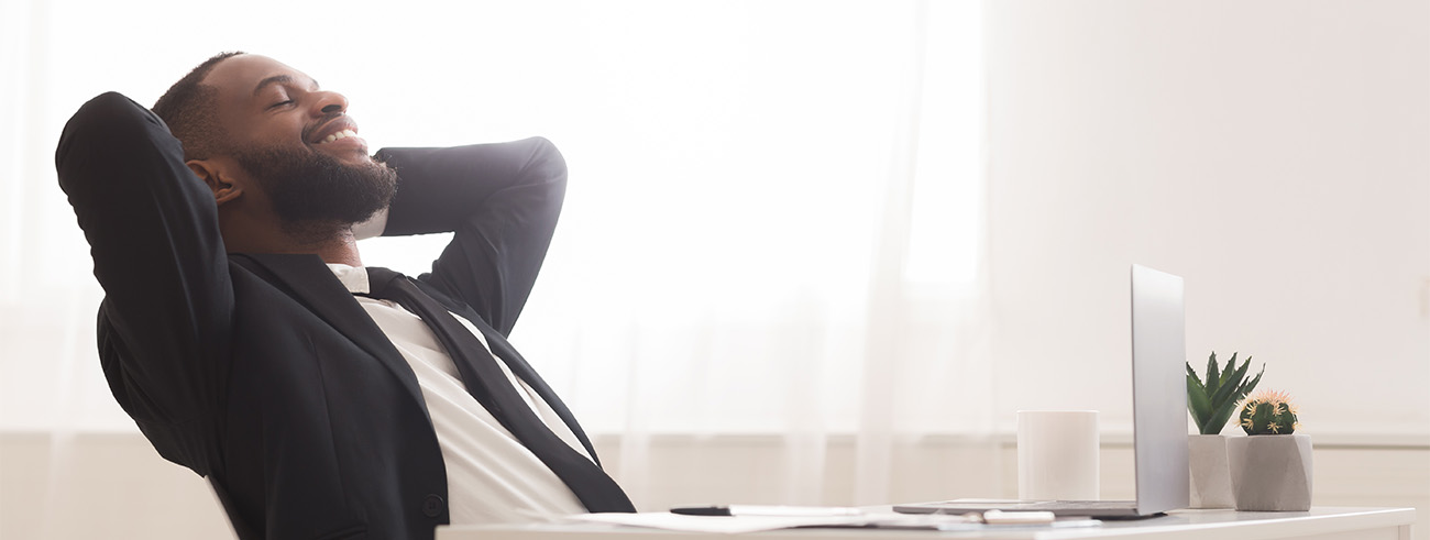 Happy man working at his desk